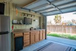 Garage with refrigerator and sink